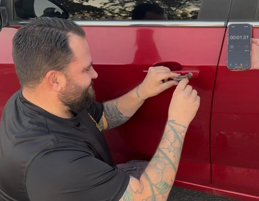 Nate performing a professional vehicle door unlock at the roadside.